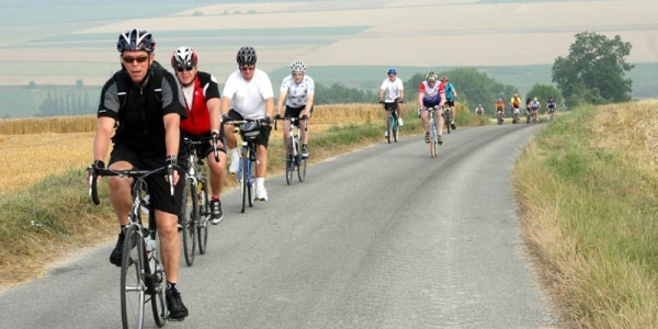 London to Paris People cycling through the picturesque English countryside.